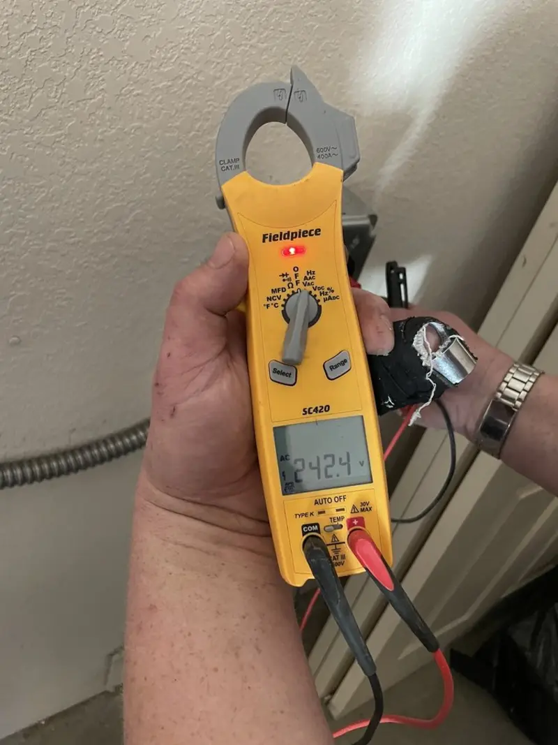 Voltage testing with clamp meter during Generator Installation in Harrisonburg